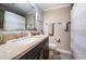 Bathroom featuring a vanity with granite countertop and a shower with tiled walls at 1868 Juarez S Way, St Petersburg, FL 33712