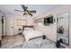 Bedroom with a ceiling fan, window, a large mirror, and neutral-toned decor at 1868 Juarez S Way, St Petersburg, FL 33712