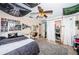 Unique bedroom with tapestries, a hammock chair, closet space, and a gray rug at 1868 Juarez S Way, St Petersburg, FL 33712