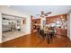 Dining room with hardwood floors and open layout to kitchen and sitting area with plenty of natural light at 1868 Juarez S Way, St Petersburg, FL 33712