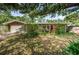 Charming single-story home featuring a well-maintained front yard and brick exterior accents at 1868 Juarez S Way, St Petersburg, FL 33712