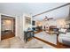 Open-concept living room featuring tile entry, hardwood floors, and comfortable seating at 1868 Juarez S Way, St Petersburg, FL 33712