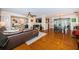 Spacious living room with wood floors connects to the dining area in an open layout at 1868 Juarez S Way, St Petersburg, FL 33712