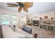 Comfortable living room with fireplace and access to the outdoor pool area, providing a relaxed ambiance at 1868 Juarez S Way, St Petersburg, FL 33712