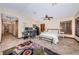Expansive main bedroom features an attached desk area, shuttered windows, and a private ensuite bathroom at 1868 Juarez S Way, St Petersburg, FL 33712