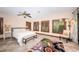 Tranquil main bedroom with shuttered windows, ceiling fan, and an abundance of natural light, creating a relaxing retreat at 1868 Juarez S Way, St Petersburg, FL 33712