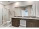 Bathroom with granite countertop, dual sinks, walk-in shower and separate toilet area at 18737 Noble Caspian Dr, Lutz, FL 33558