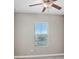 Bright bedroom with ceiling fan and large window offering plenty of natural light at 18737 Noble Caspian Dr, Lutz, FL 33558