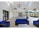 Community clubhouse featuring a large seating area, kitchen and access to the pool at 18737 Noble Caspian Dr, Lutz, FL 33558