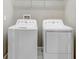 Convenient laundry room area featuring a washer and dryer for easy laundry days at 18737 Noble Caspian Dr, Lutz, FL 33558