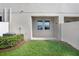 Private patio area with green space and privacy fence, perfect for outdoor relaxation at 18737 Noble Caspian Dr, Lutz, FL 33558