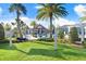 Beautiful community pool with lounge chairs, umbrellas, palm trees, and a relaxing hammock to enjoy at 18737 Noble Caspian Dr, Lutz, FL 33558