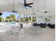 Community clubhouse and poolside area featuring a covered seating area with ceiling fans and outdoor furniture at 18737 Noble Caspian Dr, Lutz, FL 33558