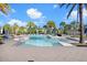 Community pool with lounge chairs and tables offering a resort-style experience for residents at 18737 Noble Caspian Dr, Lutz, FL 33558