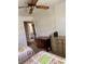 Cozy bedroom featuring twin beds, wooden furniture, and natural light at 1903 Canterbury Ln # B2, Sun City Center, FL 33573