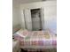 Bedroom featuring a twin bed, closet, and simple decor at 1903 Canterbury Ln # B2, Sun City Center, FL 33573