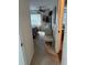 View into bedroom, featuring a bed with ceiling fan, and natural light from windows at 1903 Canterbury Ln # B2, Sun City Center, FL 33573