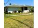 Charming single-story home with a well-maintained lawn and mature landscaping at 1903 Canterbury Ln # B2, Sun City Center, FL 33573