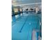 Indoor pool with natural light from windows and starting blocks at 1903 Canterbury Ln # B2, Sun City Center, FL 33573