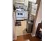 Modest kitchen featuring a white oven, white cabinets, and a stainless steel trash can at 1903 Canterbury Ln # B2, Sun City Center, FL 33573