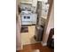 Modest kitchen featuring a white oven, white cabinets, and a stainless steel trash can at 1903 Canterbury Ln # B2, Sun City Center, FL 33573