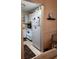 Compact kitchen design featuring white cabinets, appliances, and tile flooring at 1903 Canterbury Ln # B2, Sun City Center, FL 33573