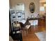 Cozy interior view of the living space featuring wood floors and an open layout at 1903 Canterbury Ln # B2, Sun City Center, FL 33573