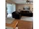 Cozy living room featuring hardwood floors, and access to the dining room at 1903 Canterbury Ln # B2, Sun City Center, FL 33573