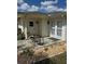 Cozy patio with chairs, perfect for outdoor relaxation and entertaining at 1903 Canterbury Ln # B2, Sun City Center, FL 33573