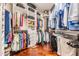 Spacious walk-in closet with custom shelving and ample storage for clothes and accessories at 19529 Lily Pond Ct, Brooksville, FL 34601
