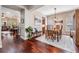 Open-concept dining room featuring hardwood floors, natural lighting, and seamless flow at 19529 Lily Pond Ct, Brooksville, FL 34601