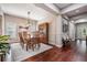 Stylish dining room with hardwood floors, modern lighting, and ample seating at 19529 Lily Pond Ct, Brooksville, FL 34601