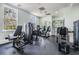 A modern gym featuring weight machines and fitness equipment with natural light at 19529 Lily Pond Ct, Brooksville, FL 34601