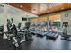 Well-equipped gym featuring treadmills and stationary bikes overlooking the community pool at 19529 Lily Pond Ct, Brooksville, FL 34601