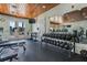 Gym area featuring weight training equipment, mirrored walls, and treadmills at 19529 Lily Pond Ct, Brooksville, FL 34601