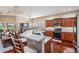 Spacious kitchen featuring a breakfast bar, stainless steel appliances, and hardwood floors at 19529 Lily Pond Ct, Brooksville, FL 34601