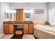 Main bathroom featuring dual vanities, a soaking tub, and ample storage at 19529 Lily Pond Ct, Brooksville, FL 34601