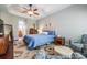 Comfortable main bedroom with an ensuite bathroom and hardwood floors at 19529 Lily Pond Ct, Brooksville, FL 34601