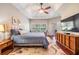 Serene main bedroom with a tray ceiling and a garden view at 19529 Lily Pond Ct, Brooksville, FL 34601