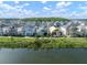 Aerial view of the homes in the community near a lake and wooded area at 28853 Seedling St, Wesley Chapel, FL 33543
