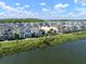 Aerial view of the homes in the community near a lake and wooded area at 28853 Seedling St, Wesley Chapel, FL 33543