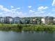 Aerial view of the homes in the community near a lake and wooded area at 28853 Seedling St, Wesley Chapel, FL 33543