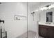 Bathroom featuring a walk-in shower, white subway tile and modern fixtures at 28853 Seedling St, Wesley Chapel, FL 33543