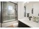 Modern bathroom featuring a shower with hexagon tile, sleek black fixtures, and a white vanity at 28853 Seedling St, Wesley Chapel, FL 33543
