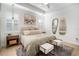 Inviting bedroom with neutral tones, soft lighting, shutter blinds, and tray ceiling detail at 28853 Seedling St, Wesley Chapel, FL 33543