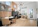 Stylish dining area with modern light fixture, and neutral decor at 28853 Seedling St, Wesley Chapel, FL 33543