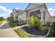 View of the exterior of the home with lush landscaping and a covered porch at 28853 Seedling St, Wesley Chapel, FL 33543