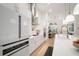 Bright, modern kitchen with white cabinets, stainless appliances, and an island with barstool seating at 28853 Seedling St, Wesley Chapel, FL 33543