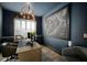 Home office features custom built-ins, a large window, a statement chandelier, and a framed map of Staten Island at 28853 Seedling St, Wesley Chapel, FL 33543