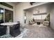 Inviting outdoor patio with a dining area, a cozy lounge space, and a stylish fire pit at 28853 Seedling St, Wesley Chapel, FL 33543
